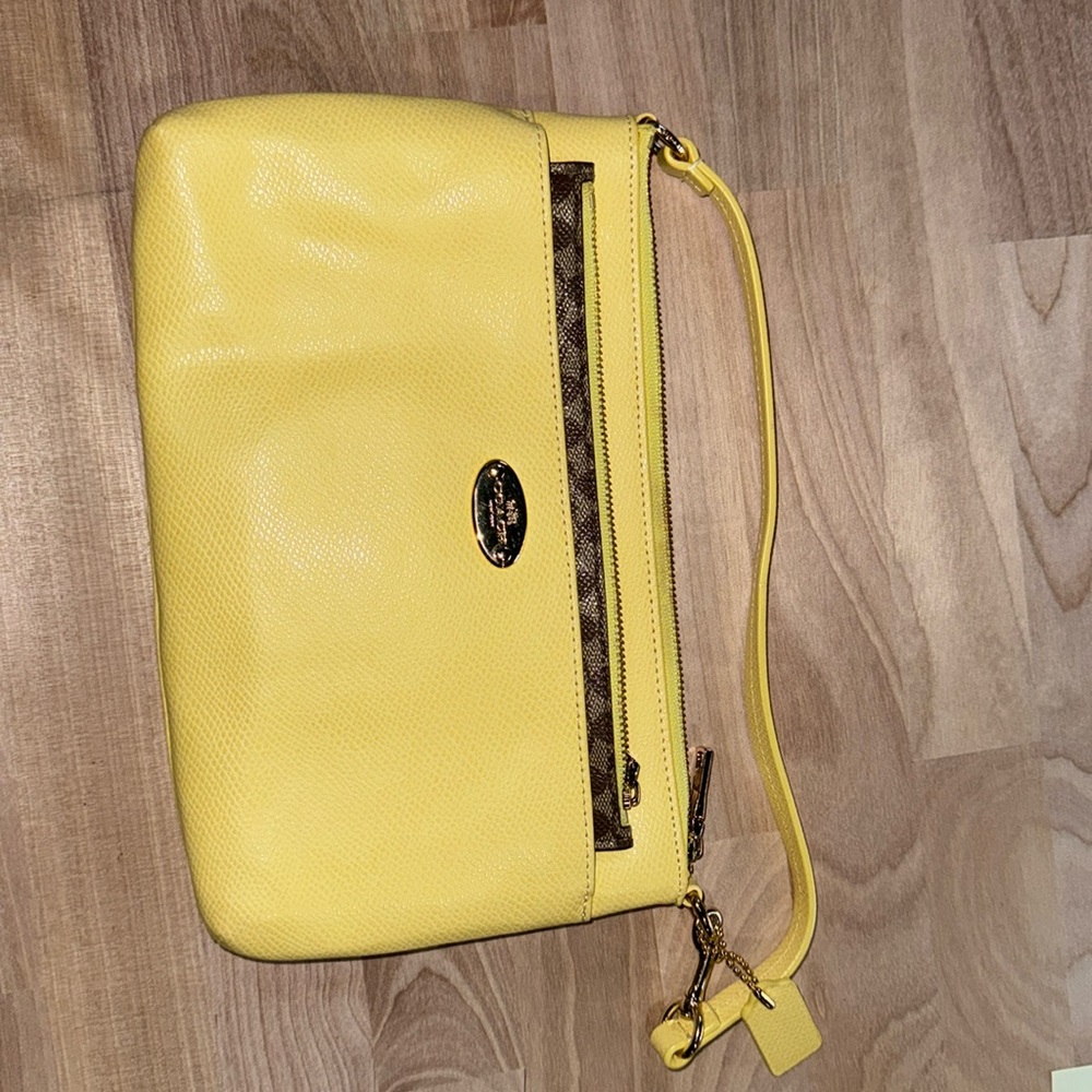 Coach wristlet, coated canvas.